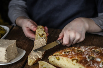 ciabatta - bread with olives on a wooden surface