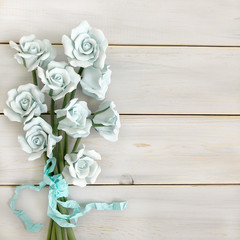 blue roses on a wooden background, wood exposition, flowers