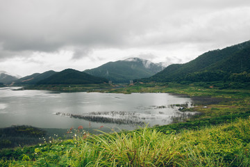 Fog day at the mountain and river in nature. Have the forest around.