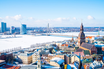 Aerial view of the Riga during winter time with Dome Cathedral, statue of liberty, Daugava river...