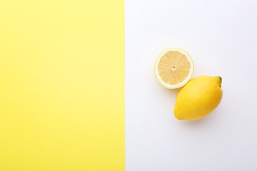 Ripe lemons on colorful background