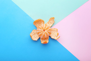 Ripe mandarin on colorful background