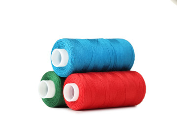 Colourful thread spools isolated on a white