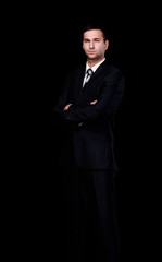 portrait of confident businessman,isolated on a black