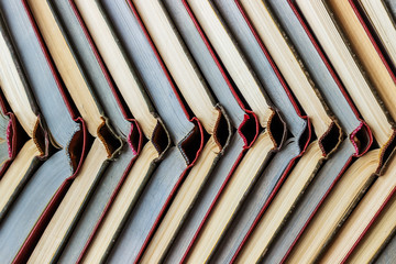 Stacks of colored books on a wooden table. concept of reading habits