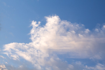 Soft, fluffy clouds formation, on blue sky background.