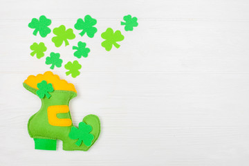 St. Patrick's Day theme colorful horizontal banner. Green leprechaun hand made shoe with gold and...