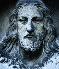 Fototapeta na wymiar Ancient statue of Jesus Christ in glory (religion, faith, death, resurrection, eternity concept)