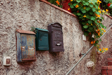Vintage iron rusty post boxes on a wall - 194186655