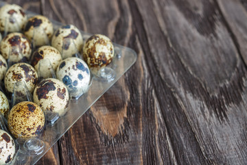 For sale quail eggs in a transparent tray, a tray for storing quail eggs, a symbol for the Easter season. Healthy eating.