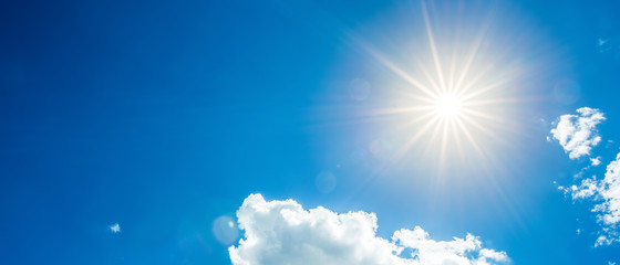 Sunny background, blue sky with white clouds and sun