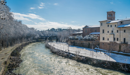 Fototapeta na wymiar Snow in Rome in February 2018, Tiberina Island in the morning, Italy.