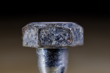 Bolts and screws for metal on a workshop table. Joinery accessories for furniture repair.
