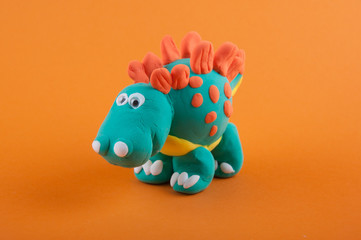 Model of Stegosaurus on orange background © virginna