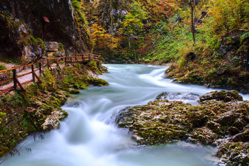 Fototapeta na wymiar Wonderful Vintgar Gorge canyon at curlicue river and beautiful autumn colors and close to Lake Bled