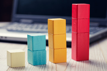 building blocks cubes against blur laptop background