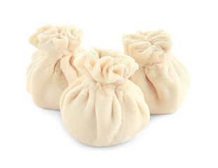 Tasty baozi dumplings on white background