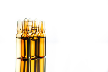 Group object of liquid medicinal agent in limpid glassware in medical laboratory. Group of ampoules with a transparent medicine in medical laboratory