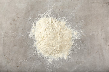 Heap of flour on grey background