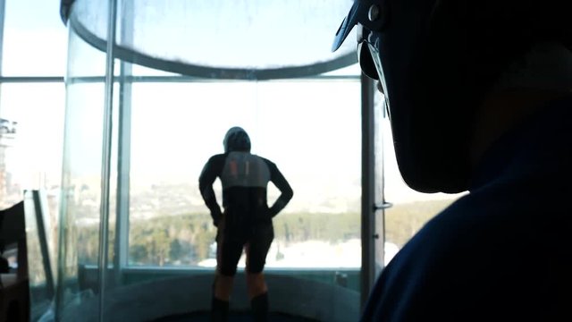 Training flight in an air tube. Professional sportsman in air tube on training