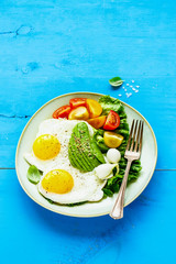 Fried eggs and vegetables
