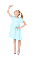 Little girl measuring height on white background