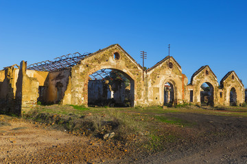 Fototapeta premium Ruins of abandoned loading bays for trucks and railway at Sao Domingos mine in Alentejo, Portugal