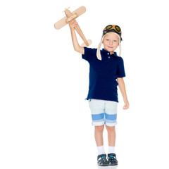 Little boy with a wooden plane.
