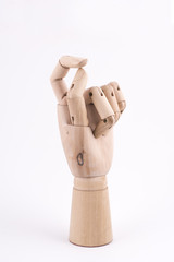 the gesture with a jointed wooden hand