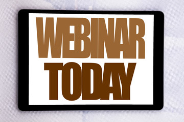 Hand writing text caption inspiration showing Webinar Today. Business concept for Online Education Event written on tablet screen on the white background.