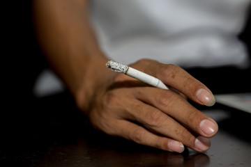 hand holding cigarette