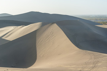 Fototapeta na wymiar Scenery of sand dunes in Dunhuang, China