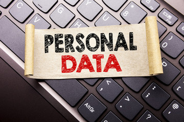 Hand writing text caption inspiration showing Personal Data. Business concept for Digital Protection written on sticky note paper on the dark keyboard background.