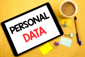 Conceptual hand writing text caption showing Personal Data. Business concept for Digital Protection Written on tablet laptop, wooden background with sticky note, coffee and pen