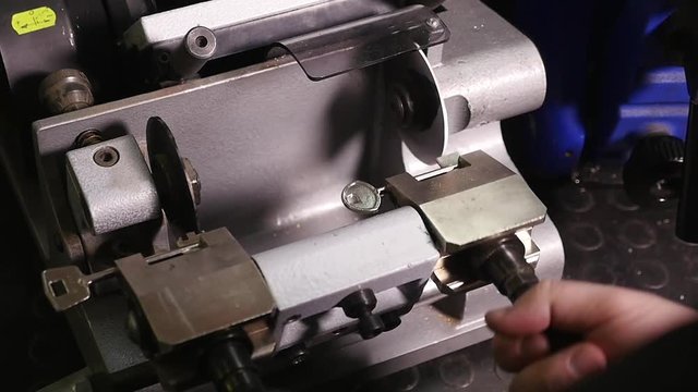 professional machine makes a new keys. production of key butterfly