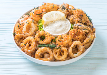 fried seafood (squids, shrimps, mussels) with sauce