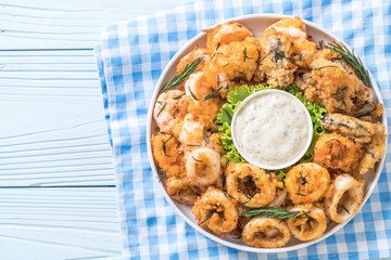 fried seafood (squids, shrimps, mussels) with sauce