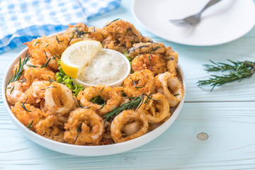 fried seafood (squids, shrimps, mussels) with sauce