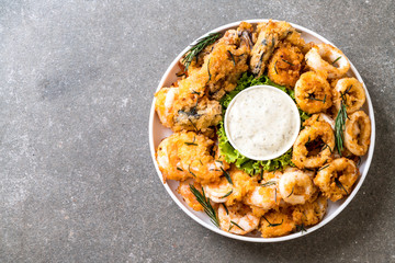 fried seafood (squids, shrimps, mussels) with sauce