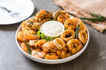 fried seafood (squids, shrimps, mussels) with sauce