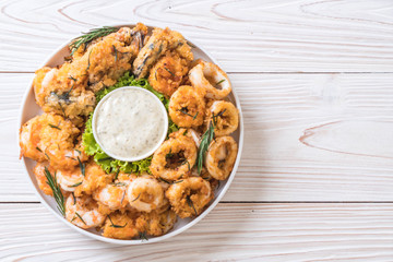 fried seafood (squids, shrimps, mussels) with sauce