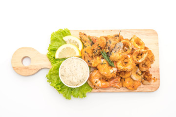 fried seafood (squids, shrimps, mussels) with sauce