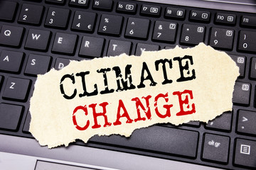 Writing text showing Climate Change. Business concept for Global Planet Warming written on sticky note paper on the black keyboard background.