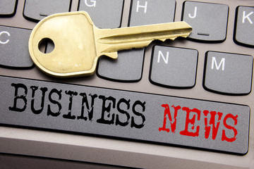 Hand writing text caption inspiration showing Business News. Business concept for Modern Online News written on keyboard key on the with key next to the text.