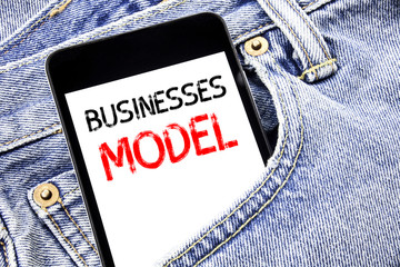 Handwriting Announcement text showing Businesses Model. Business concept for Project For Business Written phone mobile phone, cellphone placed in the man front jeans pocket.