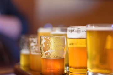 macro closeup of a beer flight in sunlight