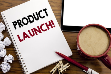 Conceptual hand writing text caption inspiration showing Product Launch. Business concept for New Products Start written on notepad note paper on the wood table with coffee in office