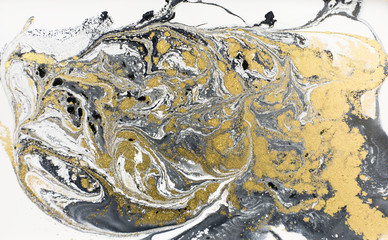 Marble abstract acrylic background. Nature black marbling artwork texture. Golden glitter.