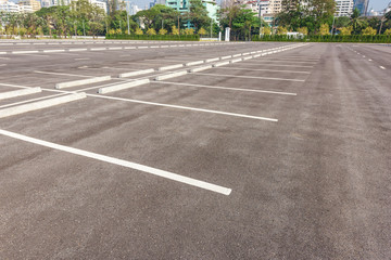 Empty parking lot at city center with blue sky