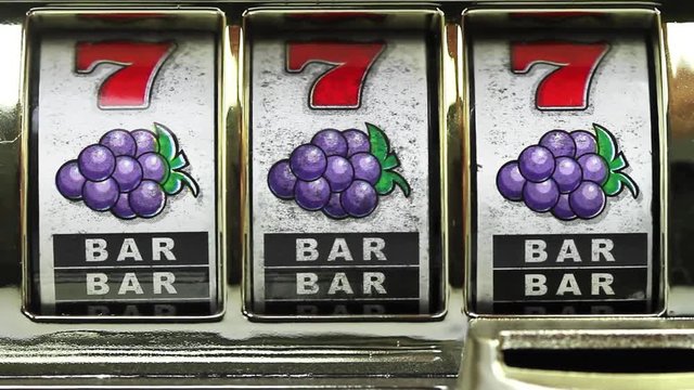 Retro slot machine spinning to win with BAR BAR BAR .